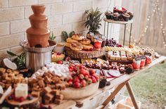 an assortment of desserts and pastries on a table