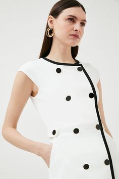 Enjoy An On-Trend 1960S Moment In This Retro Monochrome Dress. Defined By Its Neat Rows Of Contrasting Buttons And A Flattering A-Line Shape, This Sleek Design Is Perfect For Smart-Casual Spring Occasions And Features Handy Pockets For A Utilitarian Twist. Mod Spring Workwear Dresses, Classic Mini Dress With Button Closure For Spring, Fitted Workwear Mini Dress With Button Back, Classic Button Back Dress For Work, Classic Dresses For Workwear With Button Back, Classic Workwear Dress With Button Back, Fitted Dress With Button Back For Work, Classic Dresses For Work With Button Back, Fitted Mini Dress With Button Back For Work