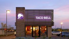 a taco bell restaurant is lit up at night