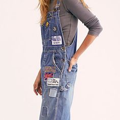 New W/O Price Tag Is An Overstock Outlet (Has Black Line Going Thru Cloth Label Name To Prevent Store Return) Authentic Riley Denim Overalls - American Made Slouchy Denim Overalls Featuring Allover Patch Detailing. - Note: These Are Reworked Overalls And Do Have Patches, Cuts And Threads Thru Out. Has A Large Cut Next To 1880 Patch On Back Rigid Denim Bootcut Side Button Closures Five-Pocket Style Adjustable Straps - Size Small Overall Bill Applique, Reworked Overalls, Riley Blue, Grey Lululemon Leggings, Cloth Label, Label Name, Army Green Pants, Spaghetti Strap Rompers, White Crop Pants