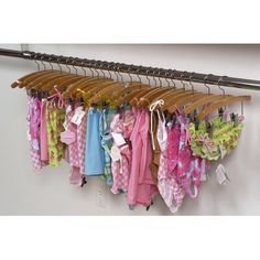 a rack with clothes hanging from it's sides