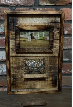 an old wooden frame with a sign on the front and bottom that says cawwra