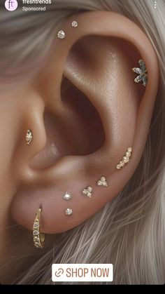 an ear with gold and diamonds on it