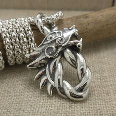 "Sterling Silver Celtic Dragon Pendant 7/8\" Wide x 1 1/2\" Long. 18\" popcorn chain with lobster clasp. Nicely boxed with a silver cloth. Keith Jack Jewelry Imported from Canada Signed by the Artist In Stock! Ships Immediately. This pendant comes standard with an 18\" Chain. Other lengths are available at no extra charge. Request 16\", 20\" or 22\" chain in the note section of your order. Switching the chain on this order may delay shipping 3 to 5 days. Ships Free within the USA 21 Day Returns Collectible Viking Sterling Silver Jewelry, Viking Mythology, Celtic Dragon, Celtic Knot Ring, Dragon Necklace, Knot Ring, Dragon Pendant, Celtic Knot, Custom Rings