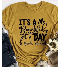 a t - shirt that says it's a beautiful day to teach students on the front