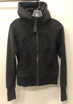 Lululemon Hiver 2013 Limited Edition Scuba Hoodie Size 4 Black Ruffles Lace RARE!!! Pre-owned in VERY GOOD Condition: No flaws. Very gently washed and air dried. Style / Description: Limited edition scuba hoodie, full zip with ruffles and black lace decoration. Very snug fitting. Soft and warm! Measurements Length: 21.5" (54 cm) Width: 15" (38cm) - pit to pit Pet/smoke-free Ships within 24 hrs of payment. Lululemon Scuba Outfit, Scuba Outfit, Scuba Jacket, Hoodie Full Zip, Scuba Hoodie, Jacket Hoodie, Lace Decor, Black Ruffle, Hoodie Jacket