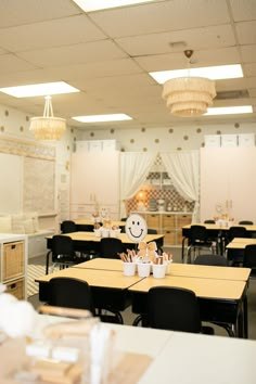 an empty classroom with desks, chairs and paper bags on the table in front of them