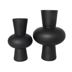 two black vases sitting next to each other