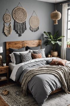 a bedroom with grey walls and wooden bed frame, hanging baskets on the wall above it