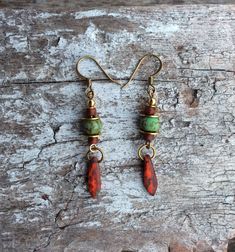 These gorgeous rustic red and turquoise drop earrings made from matte Czech glass, with raw brass flat spacer disc and brass beads on top are a delight. I have used solid brass antique bronze plate nickel free earring hooks. Perfect for any occasion and a must have for any wardrobe. 100% artisan made.. Height from top of hook 50mm Czech Jewelry, Czech Glass Necklace, Boho Chic Earrings, Tear Drop Earrings, Turquoise Drop Earrings, Boho Hippie Chic, Hippie Earrings, Red Boho, Nickel Free Earrings