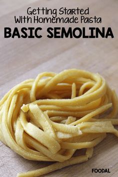 some pasta is sitting on top of a cutting board with the words, getting started with homemade pasta basic semollina