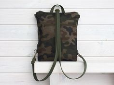 "Camo Military backpack and crossbody bag. The vegan minimalist bag is AVAILABLE in more sizes. Ideal and unique backpack as your everyday bag - travel bag, work bag, netbook bag, shopping bag. DETAILS - outer zippered pocket front and back - laptop pocket (non padded) - 2 inside open pockets - inside zipper pocket - zipper closure - metal parts antique brass MATERIALS - outer: camo WATERPROOF CORDURA fabric (100%PES) - internal: green canvas - antique brass metal hardwer - green thread This bag Casual Travel Backpack In Camouflage, Camouflage Backpack For Outdoor Activities, Functional Camouflage Bags For Everyday Use, Casual Camouflage Travel Backpack, Camouflage Travel Backpack, Camouflage Travel Bag With Adjustable Strap, Military Style Khaki Bag With Adjustable Strap, Camouflage Outdoor Backpack, Green Military Style Backpack