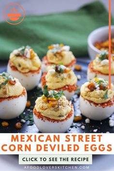 mexican street corn deviled eggs on a blue plate with text overlay that reads, click to see the recipe