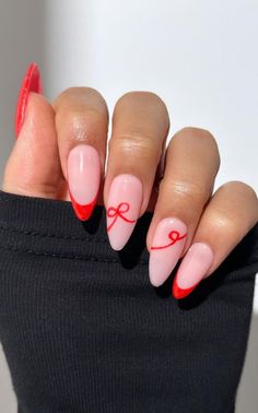 Get inspired by 30+ adorable bow nail designs, from cute 3D bow nails to short and sweet styles in pink, red, white, gold, and black. This also includes coquette nails, ribbon nails, short bow nails, french tip bow nails, bow nail art. (📷 pearliepressed IG) Nail Art Design French Tip, Cute Bow Christmas Nails, Almond Nails Bow Design, Pink And Red French Manicure, Pink Nails With Red Bow, Red Bow Nails Christmas, Ribbon Bow Nails, Nude Nails With Bow, Short And Sweet Nails Sabrina