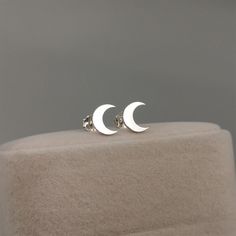 Elevate your celestial style with our crescent moon stud earrings. Handcrafted with sterling silver, these earrings exude a touch of mystical charm. The delicate crescent moon design adds a subtle yet enchanting accent to any outfit. Available in both sterling silver and gold plated options, these earrings offer versatility and timeless elegance. Embrace the allure of the night sky and adorn yourself with these celestial treasures. D E T A I L S * Listing is for one pair earrings(2pcs). * Cresce Hypoallergenic Sterling Silver Crescent Jewelry, Sterling Silver Moon Phase Earrings, Sterling Silver Half Moon Earrings With Moon Phase Detail, Sterling Silver Half Moon Phase Earrings, Dainty Moon-shaped Moon Phase Earrings, Dainty Moon-shaped Earrings, Sterling Silver Moon Charm Earrings For Everyday, Minimalist Silver Moon Phase Earrings, Sterling Silver Moon Earrings For Everyday