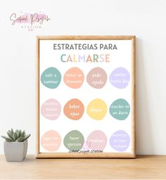 a poster with the words in spanish on it next to a potted succulent