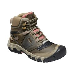 a women's hiking boot on a white background