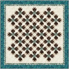 a quilt made with brown and teal colors on a white background, the pattern is very