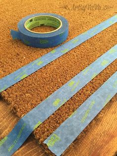 blue tape sitting on top of a wooden floor