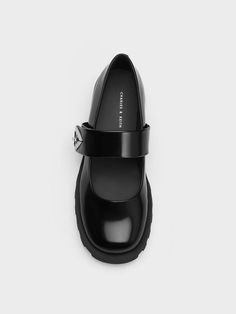 This product is made with at least 20% sustainable materials by weight. CHARLES & KEITH uses recycled, degradable, organic, and water-based materials in our eco-conscious collection. Featuring a shiny boxed finish, these understated black Trice Mary Janes will instantly set you apart from the crowd. To top it off, they are adorned with metallic accents on the sides, which add an edgy touch to the design. Whether you opt for a cute dress or a grunge-inspired outfit, these Mary Janes will put a great finishing touch on your look. Charles And Keith Shoes, Faux Leather Heels, Size Chart For Kids, Charles Keith, Black Box, Cute Dress, Eco Conscious, Sustainable Materials, Metallic Accents