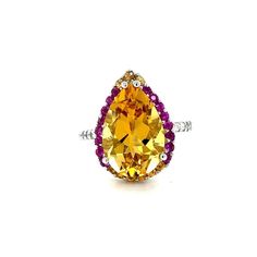 This gorgeous ring has a magnificent Pear Cut Citrine Quartz weighing 5.28 Carats and is surrounded by 25 Pink and Yellow Sapphires that weigh 0.60 carats and 20 Round Cut Diamonds that weigh 0.37 carats. (Clarity: SI, Color: F) The total carat weight of the ring is 6.25 carats. Each stone is handpicked and carefully curated to create a unique piece by our in-house designer and jeweler! The Citrine measures approximately at 11 mm x 16 mm. It is set in 14K White Gold and weighs approximately 3.8 Gorgeous Ring, Gold Cocktail Ring, Gold Cocktail, Pink And Yellow, Yellow Sapphire, Sapphire Diamond, Pear Cut, Ring Size 7, Cocktail Ring