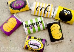 halloween candy wrappers with owls and pumpkins on them are sitting on the ground