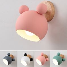 the mickey mouse light is mounted on the wall and has three different color options to choose from