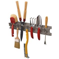 there are many different tools hanging on the wall with it's hooks and handles