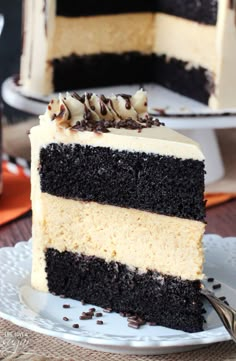 a slice of cake with white and black frosting