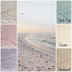 several different colors of yarn on the beach