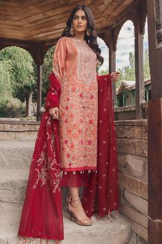 Pakistani designer cotton outfit is added to store with beautiful embroidery all over. Shirt in Tea pink color is embellished with multi color beautiful thread embroidery in block design. Back of shirt is also embroidered. Dress is paired with embroidered net border for sleeves and a daman border. Trouser: Elegant cotton trouser in red color is also added with this designer winter wear. Dupatta: Elegant designer cotton dress is paired with cotton net dupatta giving a refreshing look to your wint Pakistani Designer Suits, Unstitched Dress Material, Cotton Outfit, Black Saree, Lawn Shirts, Lawn Suits, Eid Collection, Pakistani Designers, Suit Fabric