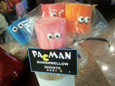 four marshmallows with googly eyes on them in a plastic bag sitting on top of a counter