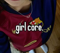 the girl is wearing a red and blue shirt that says girl core on it's chest