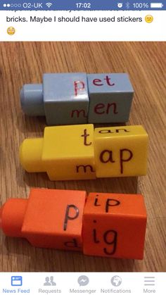 three erasers with words written on them sitting on a wooden table next to each other