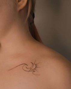 a woman with a small tattoo on her chest