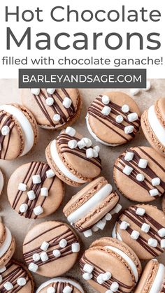 chocolate macarons with white and chocolate ganache on top are arranged in rows