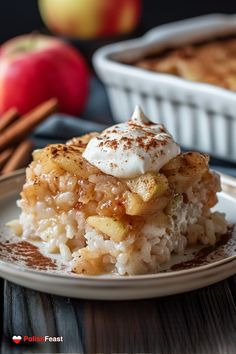 a piece of pie on a plate with apples in the background