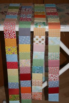 several strips of colorful fabric on a table