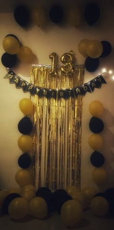 a party decoration with balloons and streamers