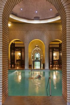 an indoor swimming pool in a large building