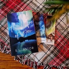 the hope of you by s llastor is laying on a plaid blanket next to two books