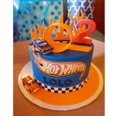 a birthday cake with hot wheels on it