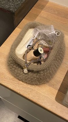 an open purse sitting on top of a wooden table