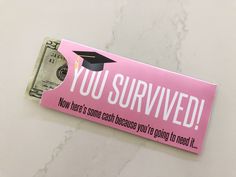 a pink sign that says, you survived now there's some cash because you're going to mean it