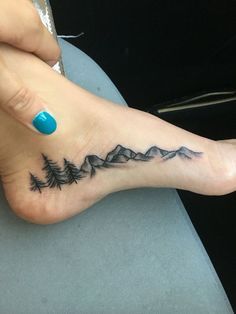 a person with a small tattoo on their foot