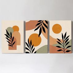 three paintings on the wall with plants and oranges