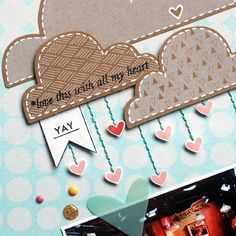 a scrapbook page with hearts and clouds