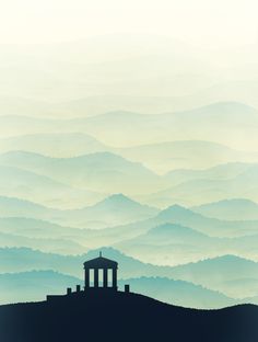 the silhouette of a building on top of a hill with mountains in the background and foggy sky