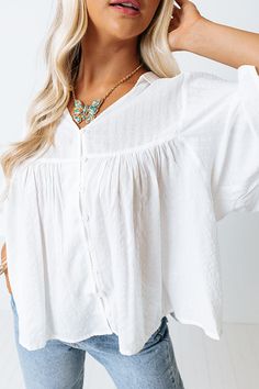 You are sure to receive endless compliments when you complete your look with our cute white 'Ready To Scroll' top featuring lightweight material, a button up front with a collared v-cut neckline, oversized half sleeves, and a relaxed babydoll silhouette that falls into a straight hemline! Measurements S : Bust 46", Hip 56", Length 24", Sleeve Length 12.5", Waist 50". M : Bust 48", Hip 58", Length 24.5", Sleeve Length 13", Waist 52". L : Bust 50", Hip 60", Length 25", Sleeve Length 13", Waist 54" White V-neck Blouse With Button Closure, White Blouse With Button Closure For Everyday, Babydoll Top, V Cut, V Cuts, Half Sleeves, Off Shoulder Blouse, Baby Dolls, Button Up