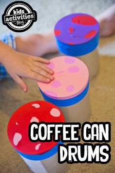 coffee can drums for kids to play with on the floor in front of their child's hand